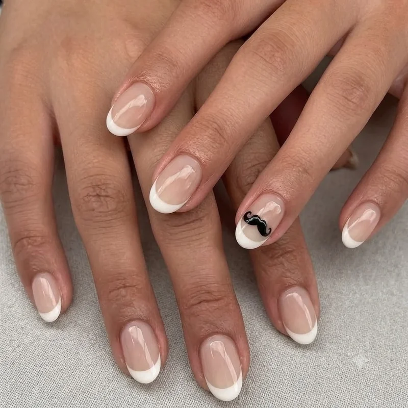 French tip nail set featuring a single mustache accent nail novelty design from 2016 nail art