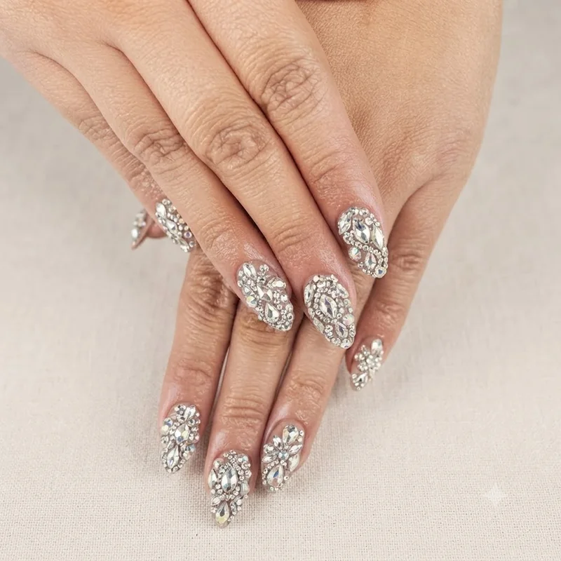 Gem embellished nail set with rhinestones covering multiple nails in the bold, maximalist 2016 nail art style