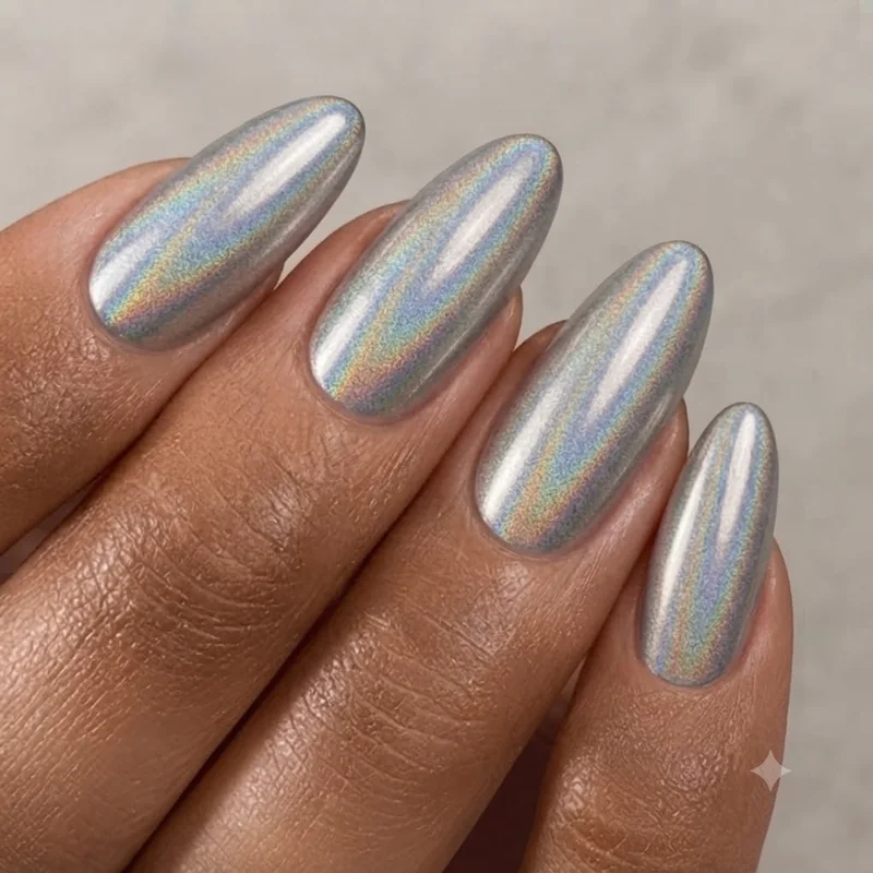 Holographic chrome nail finish in silver tone showing the metallic 2016 manicure trend