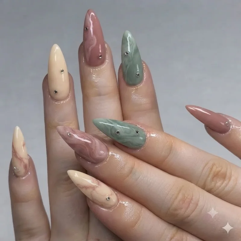 Close-up of cottagecore nails featuring hand-painted mushroom and toadstool nail art on cream base