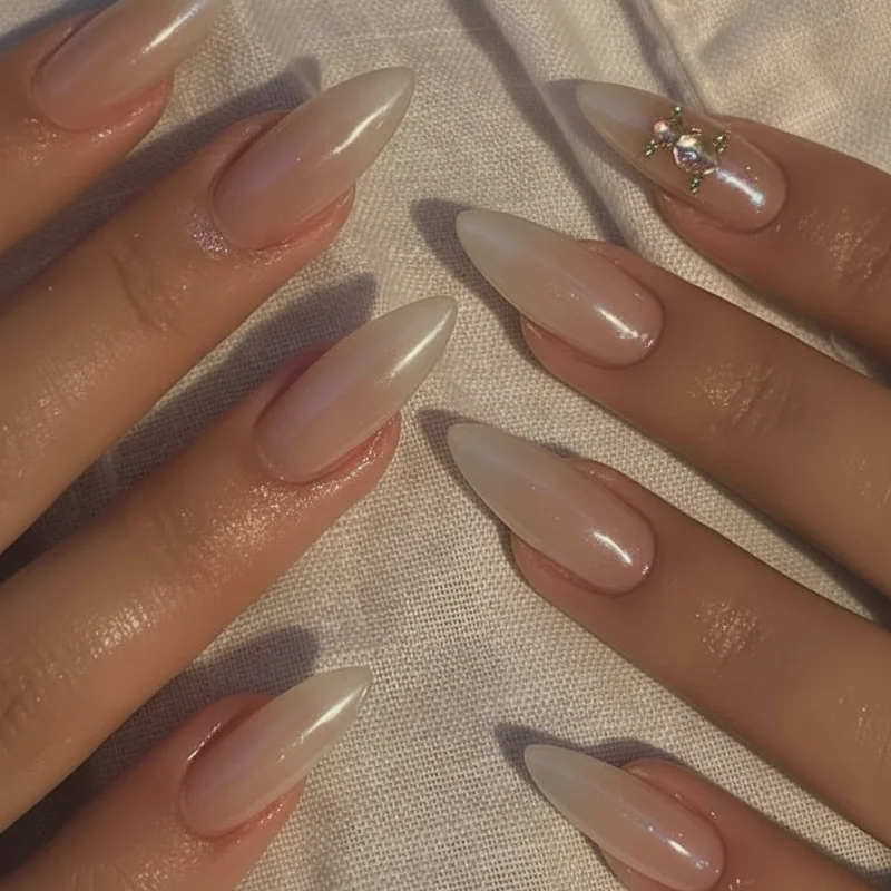 Almond nail shape for quiet luxury nails showing the tapered silhouette that elongates fingers and makes understated shades look intentional and expensive