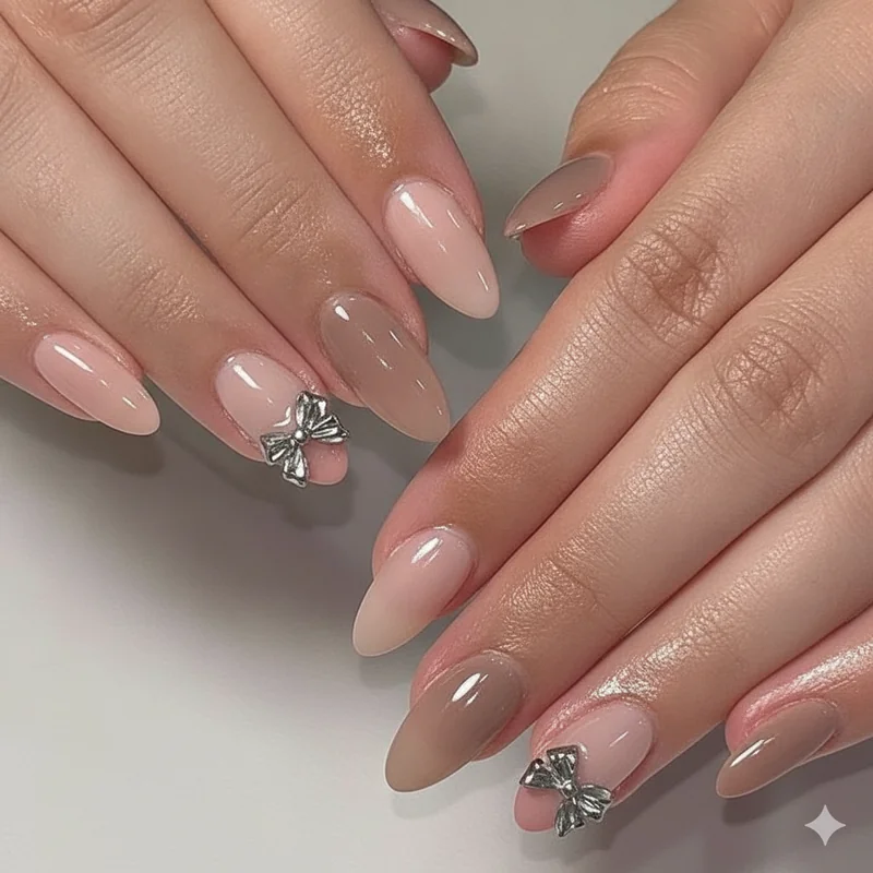 Quiet luxury nail colour palette showing milky pink, vanilla, buttercream, and latte taupe shades on almond nails for an understated expensive look