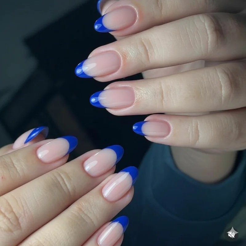 Cobalt blue French tip almond acrylic nails for bold colour statement manicure with vivid blue smile line design