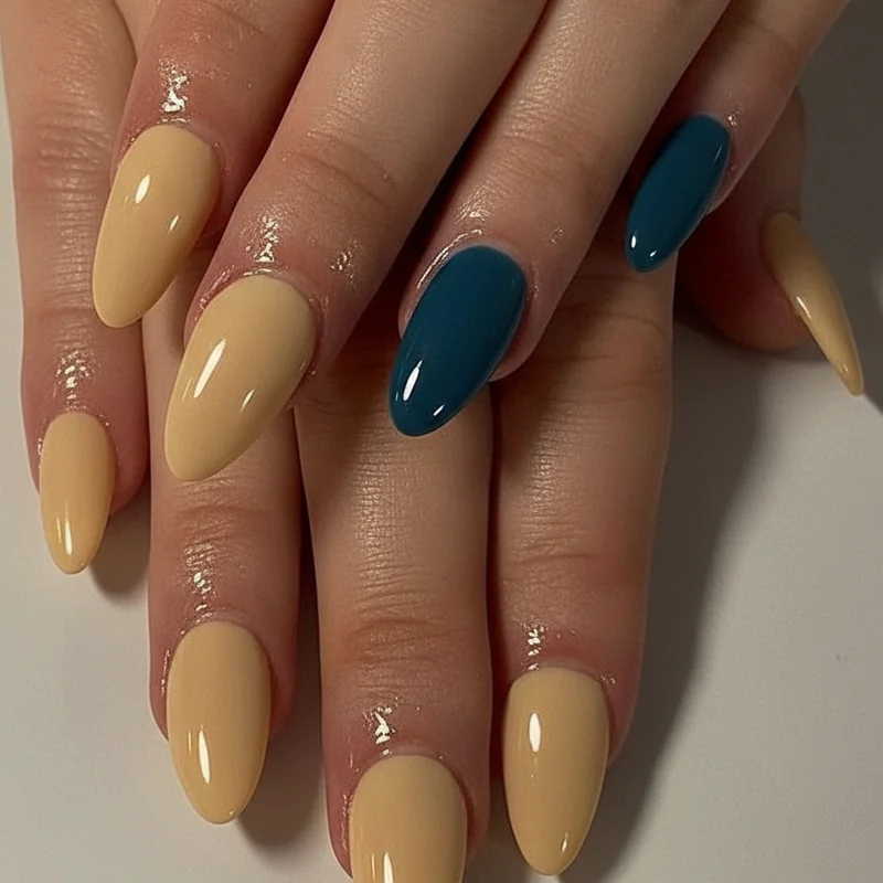 Almond nail colour split 2026 showing butter yellow clean neutrals on one side and petrol blue deep cherry moody tones on the other