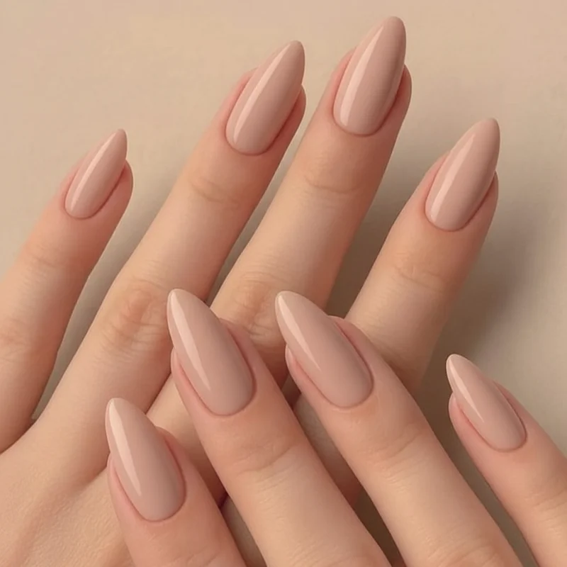 Almond nails on a hand showing classic medium length and neutral shade with slim tapered tip and soft rounded peak