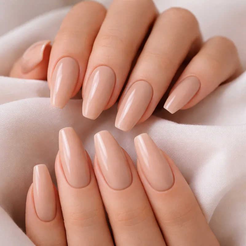 Almond vs coffin nails flat lay comparison showing both shapes side by side on neutral background for direct visual verdict reference