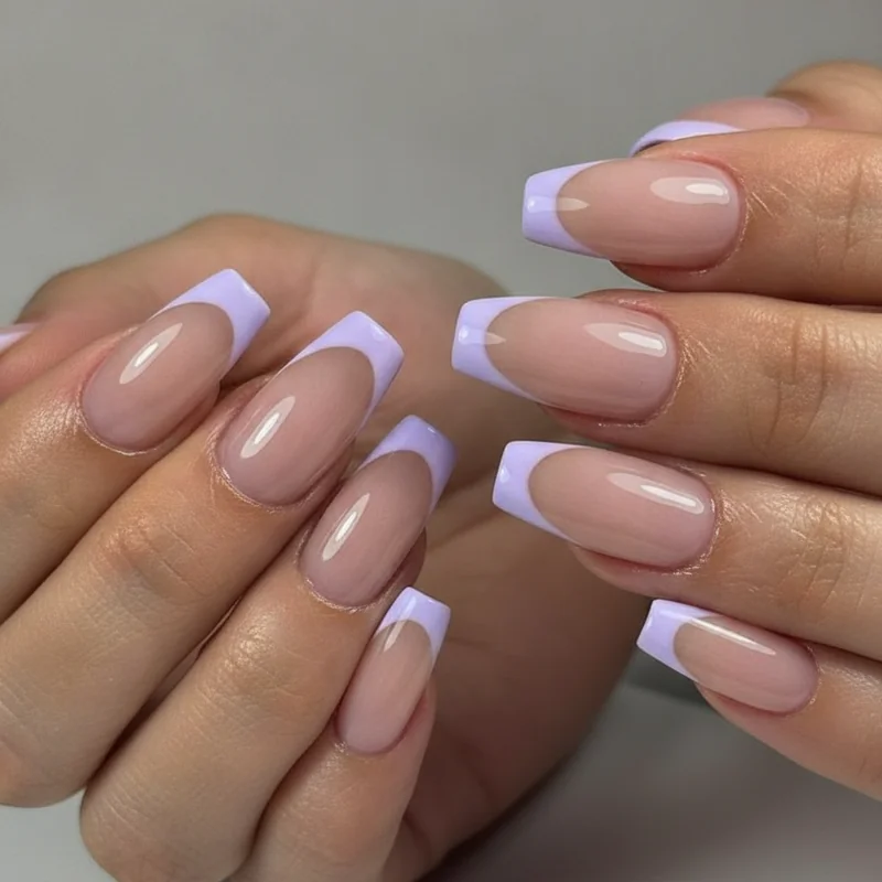 Simple school-appropriate back to school nails featuring milky sheer nude finish and minimal pastel French tip on short squoval shape dress-code safe
