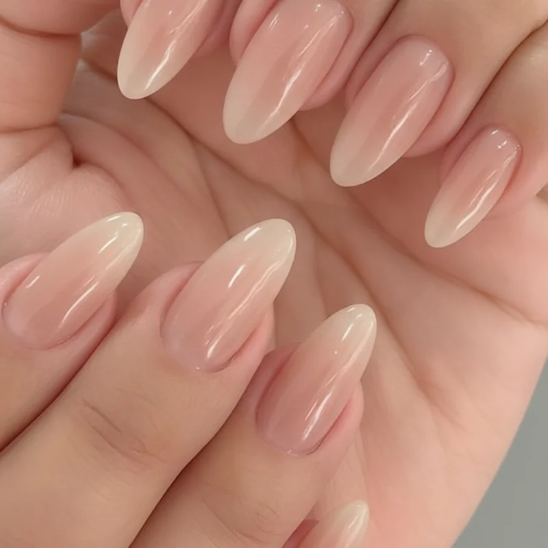 Press on first day of school nails in short almond milky nude finish salon quality press ons applied with nail glue for school