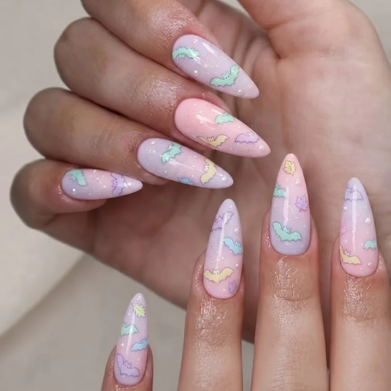 Pastel bat nails soft girl aesthetic design on lilac and pink nail base for fall