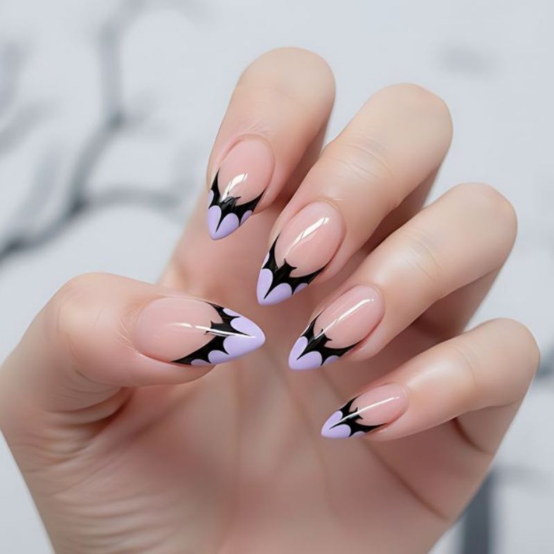 Black bat silhouettes flying across orange Halloween nail background with multiple sizes for depth