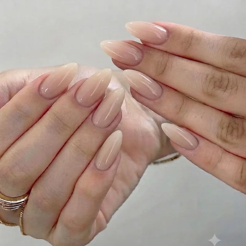 Off duty supermodel style hands with minimal nude manicure and natural finish