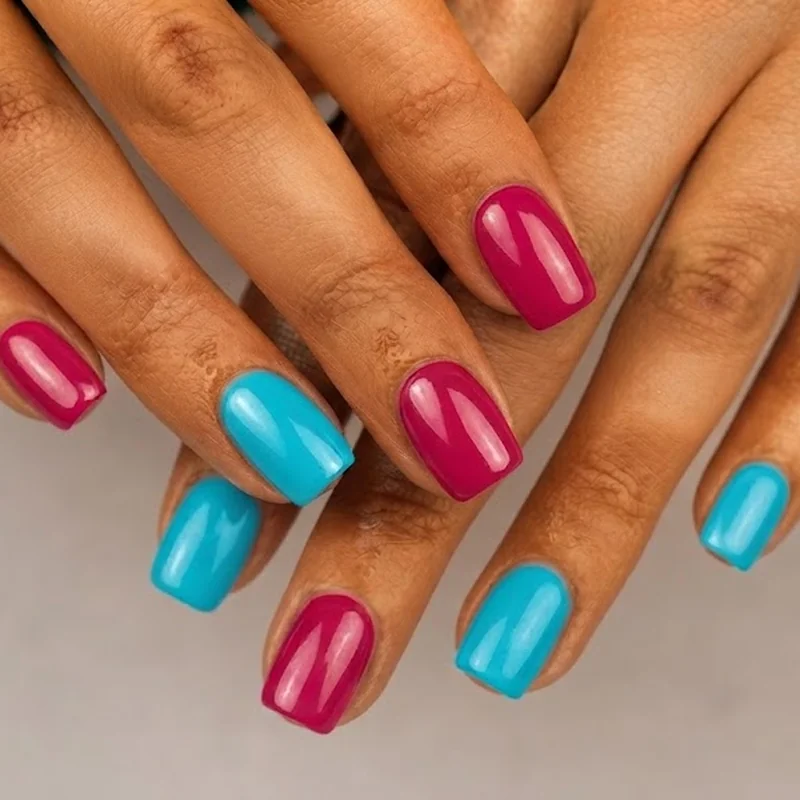 Warm peach and lavender pastel nail polish manicure on tan skin, soft everyday look
