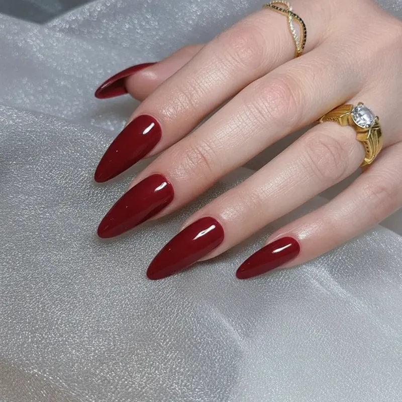 Cherry ruby cool blue-based red nail polish on fair pale skin with classic contrast and no orange cast on the complexion