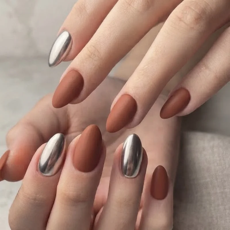 Cowboy Carter nails wide shot showing silver chrome and earthy tone manicure combination