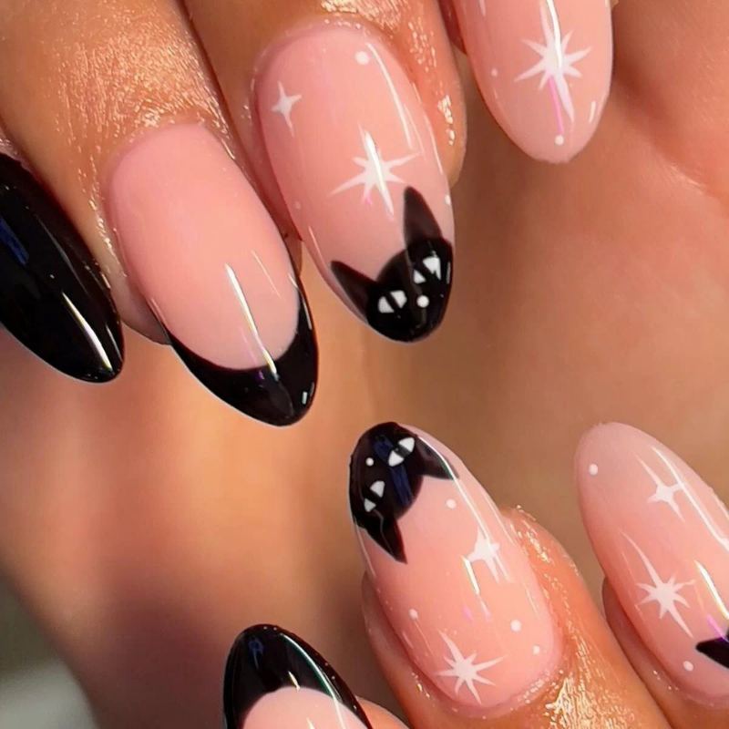 Minimalist black cat silhouette on nude nail base showing curved back and pointed ears for Halloween