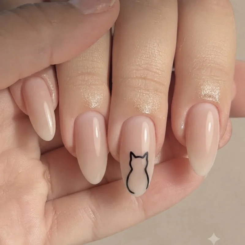 Black cat nails classic silhouette design in matte black on nude almond nail shape for everyday styling