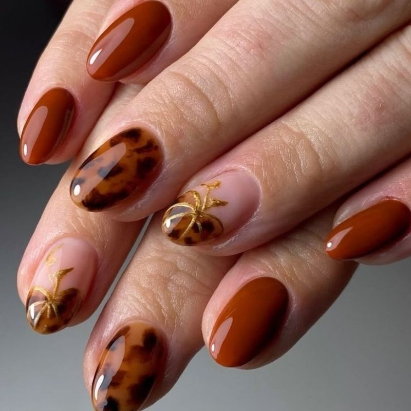Blooming gel tortoiseshell nails with brown orange and cream organic pattern perfect for fall