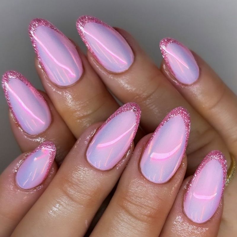 Applying thin layer of blooming gel over cured pink base coat before adding design