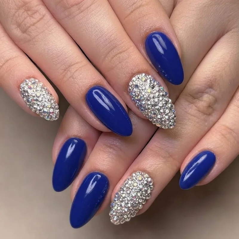 Bold color braider nails with rhinestone bling accent on longer fingers
