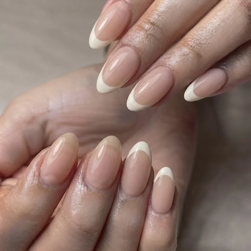 British manicure sheer nude nails styled to show natural finish versus classic French tip