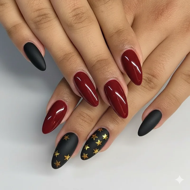 Deep red and black alternating matte and gloss nail designs with gold star on coffin shape for Bruno mars concert nights