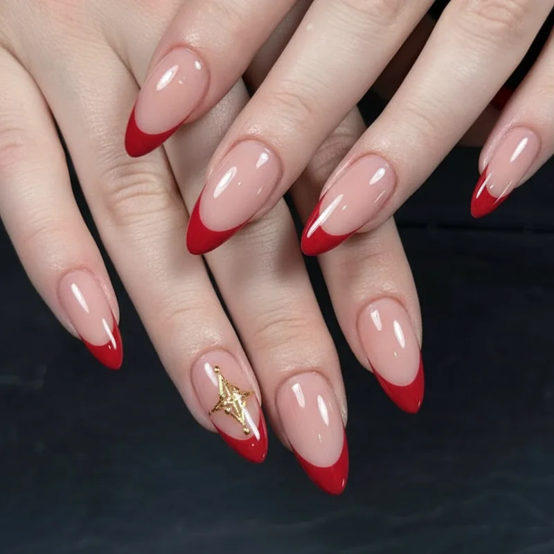 Glossy red French tip nails with gold star accents on almond for Bruno mars Romantic Tour concert night nail design looks
