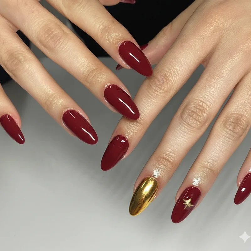 Short nail Bruno mars designs on round oval and squoval shapes in glossy red and gold chrome with single star accent detail