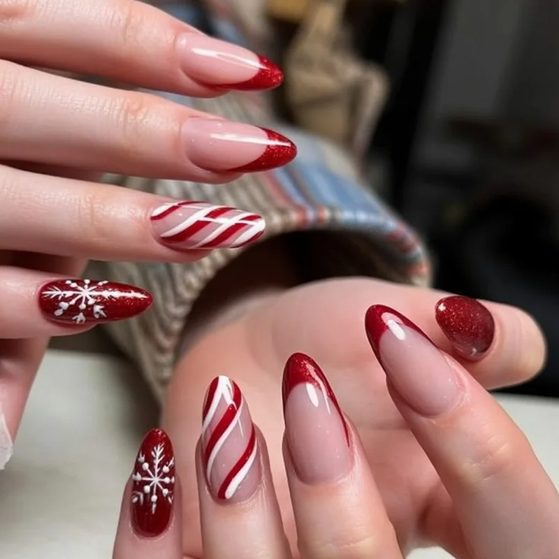 Elegant candy cane French tip nails combining festive stripes with classic manicure style