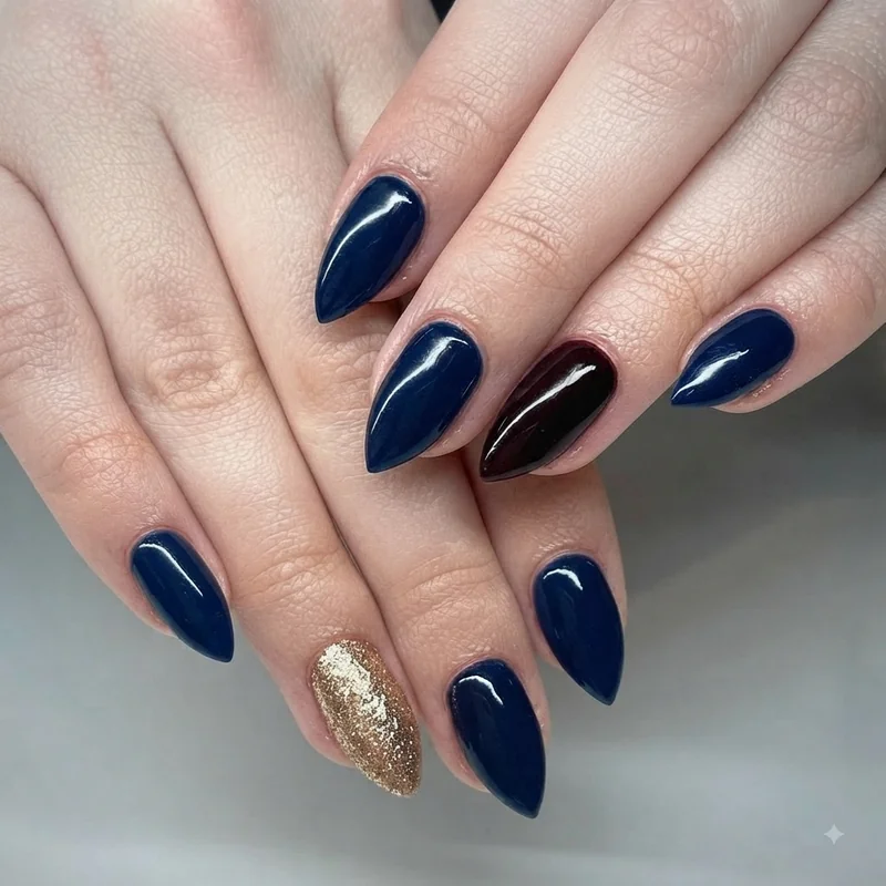 Deep blue and burgundy black christmas nail colors for skin tone with festive metallic accent nail detail