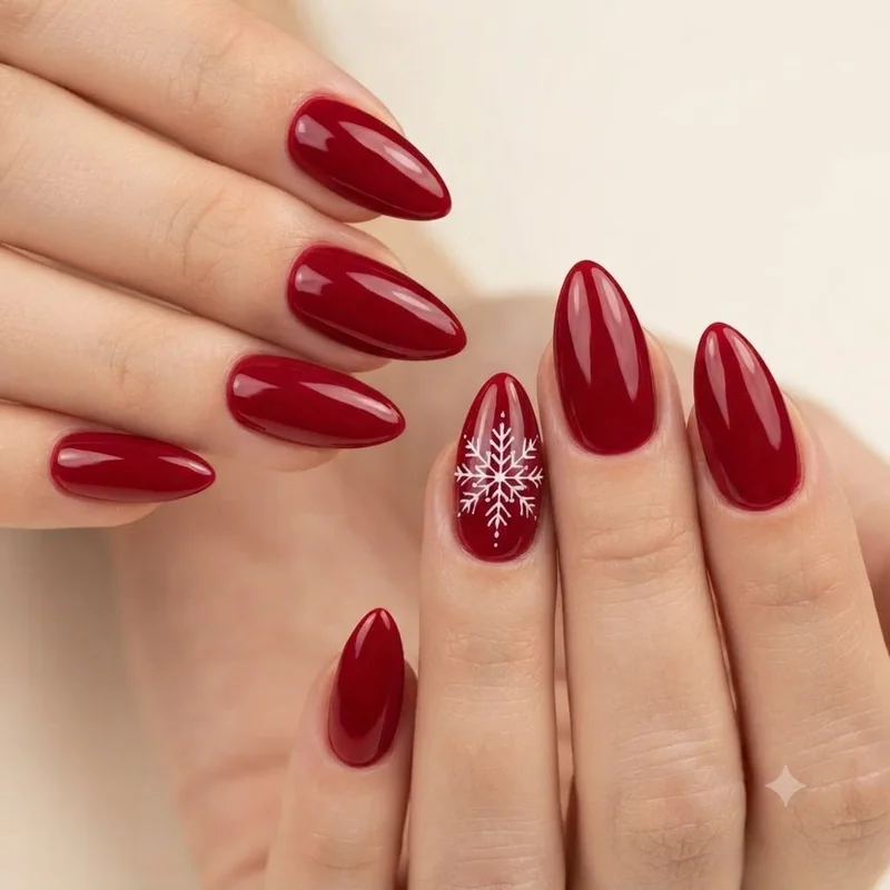 Red christmas nails with a white snowflake accent nail, playful holiday nail design detail