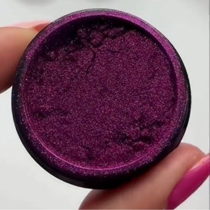 chrome powder being applied to christmas nails with silicone applicator showing buffing technique step by step tutorial