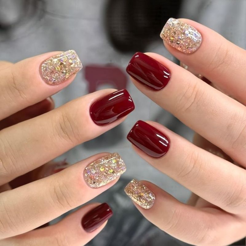 classic bright candy apple red christmas nails with glossy finish on short square nails