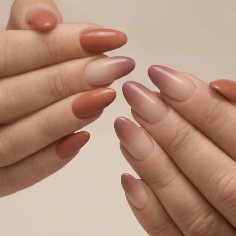 Comparison of ombre nails versus aura nails showing directional cuticle to tip fade versus centre bloom gradient technique on coffin shape