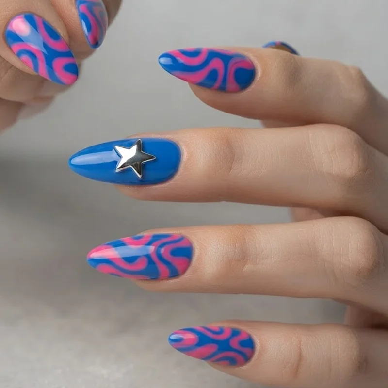Electric blue and hot pink colorful y2k nails with star chrome accent nail in almond shape