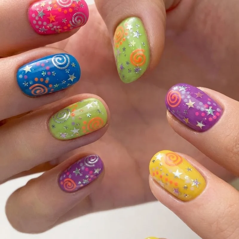Multicolor skittle y2k manicure with five saturated shades and mixed dot star swirl motifs