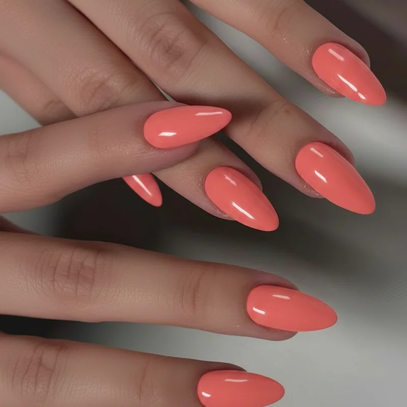 Coral nail polish swatches across four skin tones fair cool to deep warm showing undertone and contrast shade differences