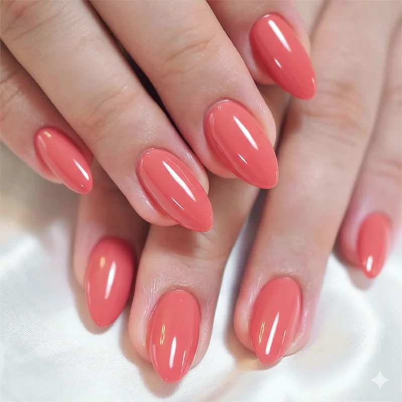 Coral nail polish on short nails round versus almond shape showing which creates the most flattering nail lengthening effect
