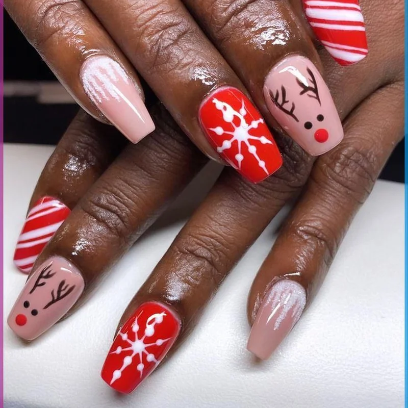 Cute Rudolph face nail design with brown color, black antlers, and shiny red nose