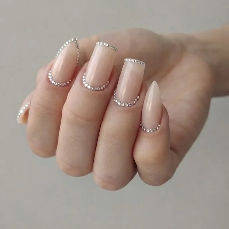 Diamond nails crystal French tip placement detail shown on square and stiletto nail shapes up close