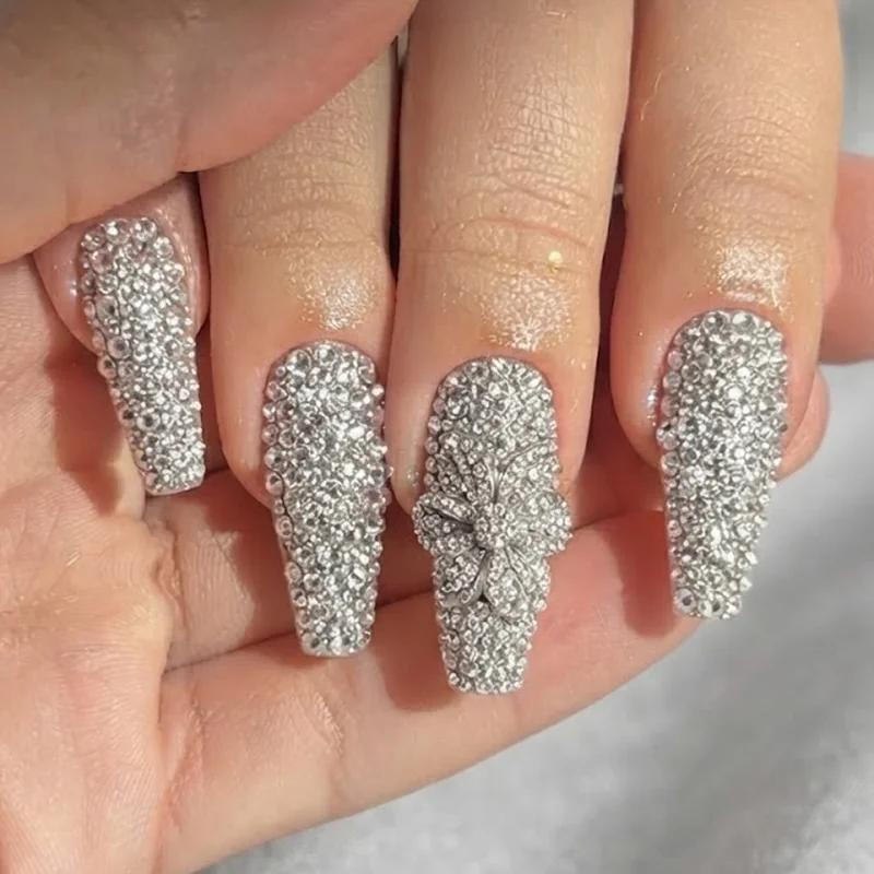 Diamond nails statement full pave rhinestone floral design on a coffin shape nail for a maximal event-ready look