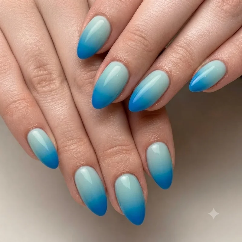 Seaglass teal dip nail colors 2026 manicure with soft ombre blending on almond shape nails