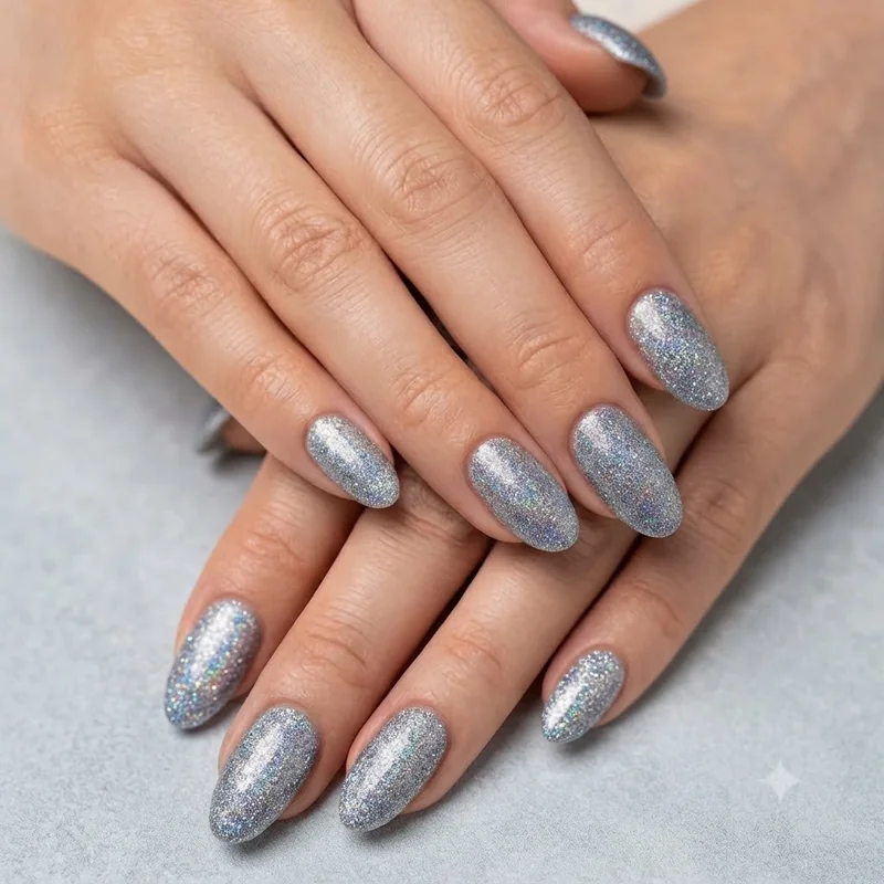 Black base dip nails with chunky silver and gold glitter creating dramatic high contrast sparkle