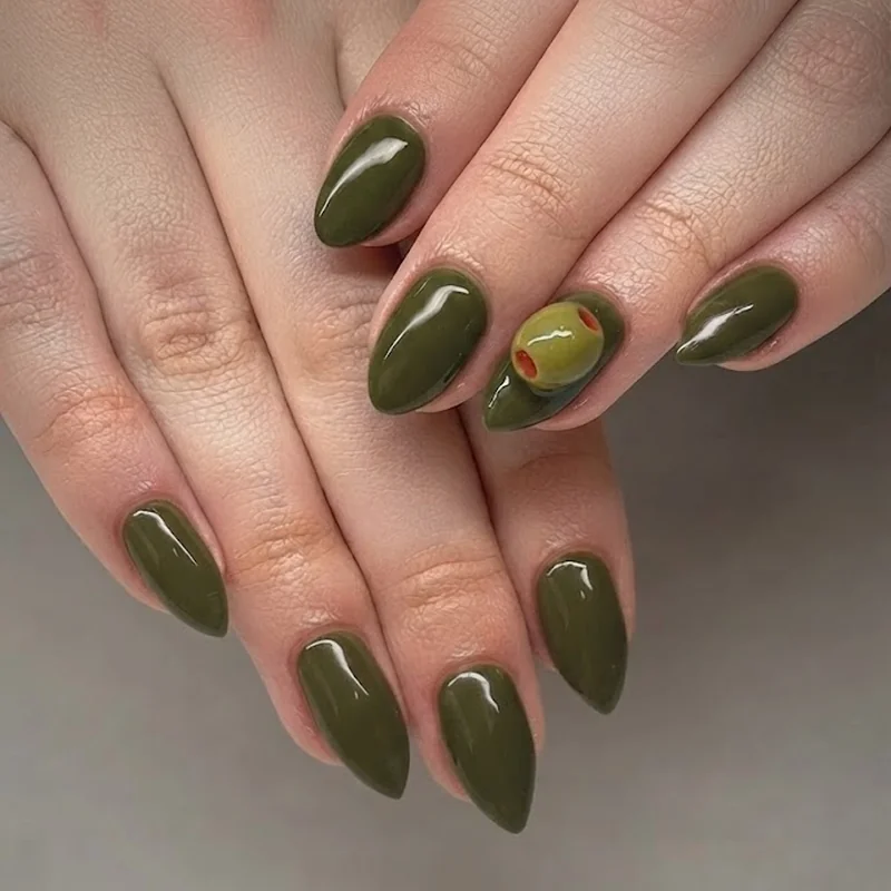 3D sculptural olive charm nail art accent on dirty martini nails with realistic pimento detail