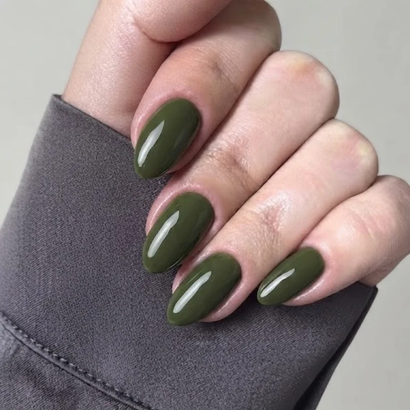 Classic glossy olive green dirty martini nails in an almond shape with high-shine gel finish