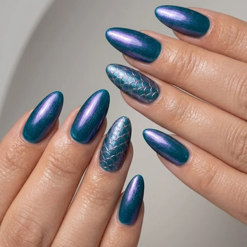 Ariel-inspired ocean teal and purple almond nails with shimmer topcoat and mermaid scale accent