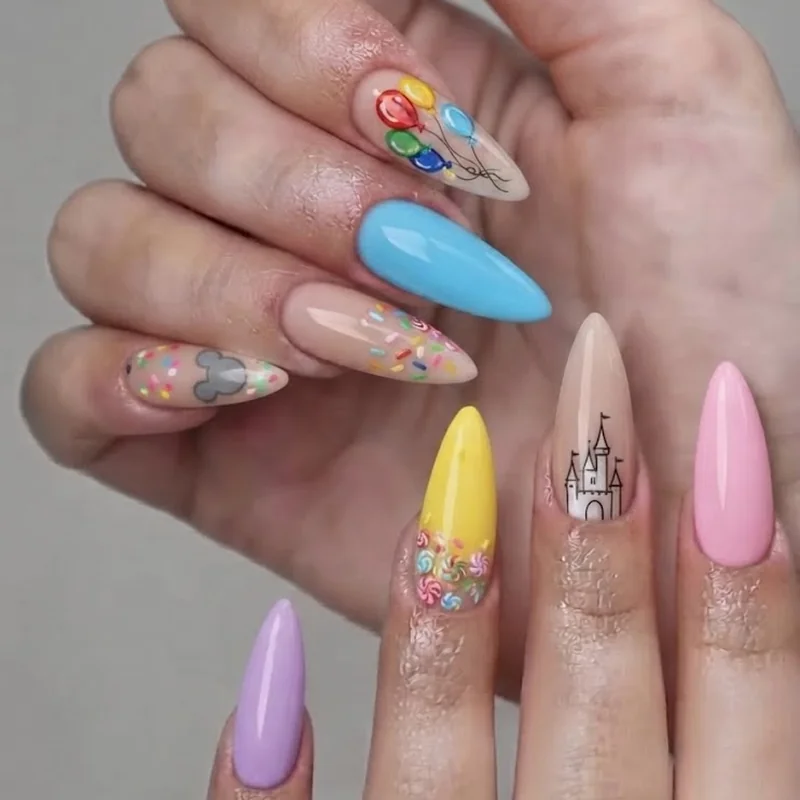 Colorful mismatched Mickey balloon and castle nail art design with one style per nail for disney world nails