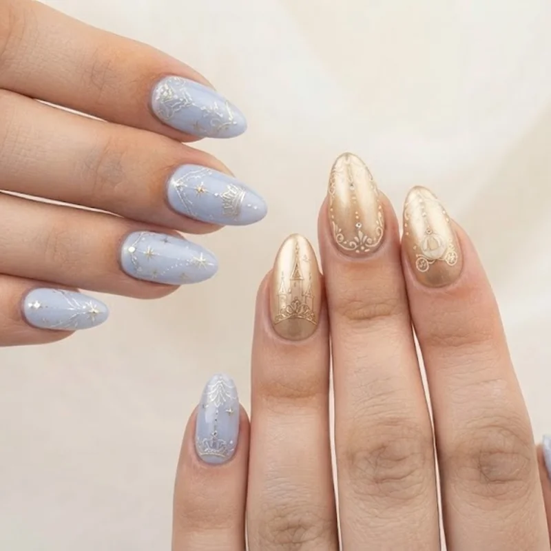 Soft pastel princess inspired disney world nails in Cinderella blue and Belle gold with delicate line art detail