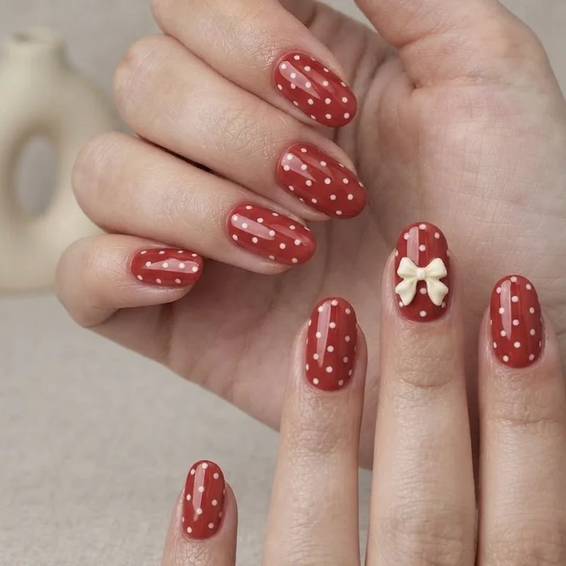 Red and white polka dot Minnie-inspired disney world nails on short to medium length nails
