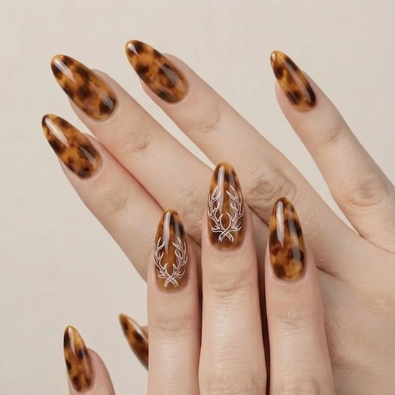 Sven reindeer inspired frozen nails earthy brown tortoiseshell design with antler accent