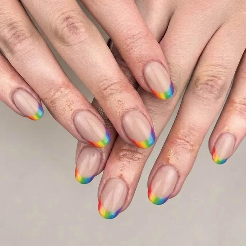 Bold colorful short disney nails with rainbow multicolor French tip design